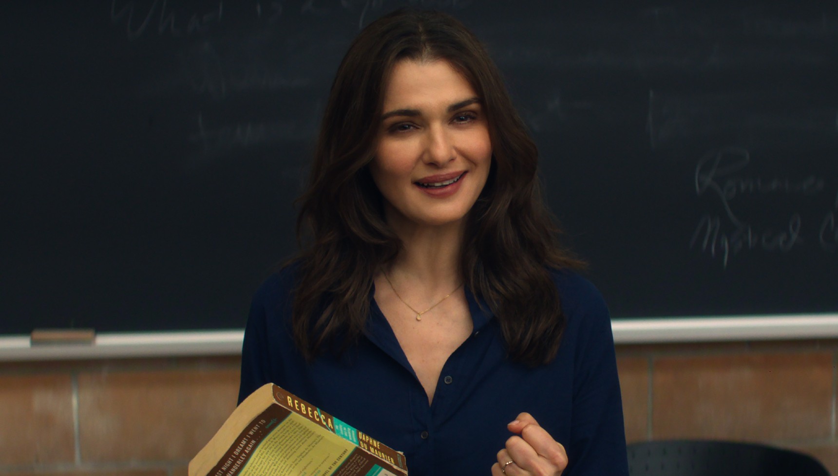 Rachel Weisz holding a copy of Rebecca in Vladimir