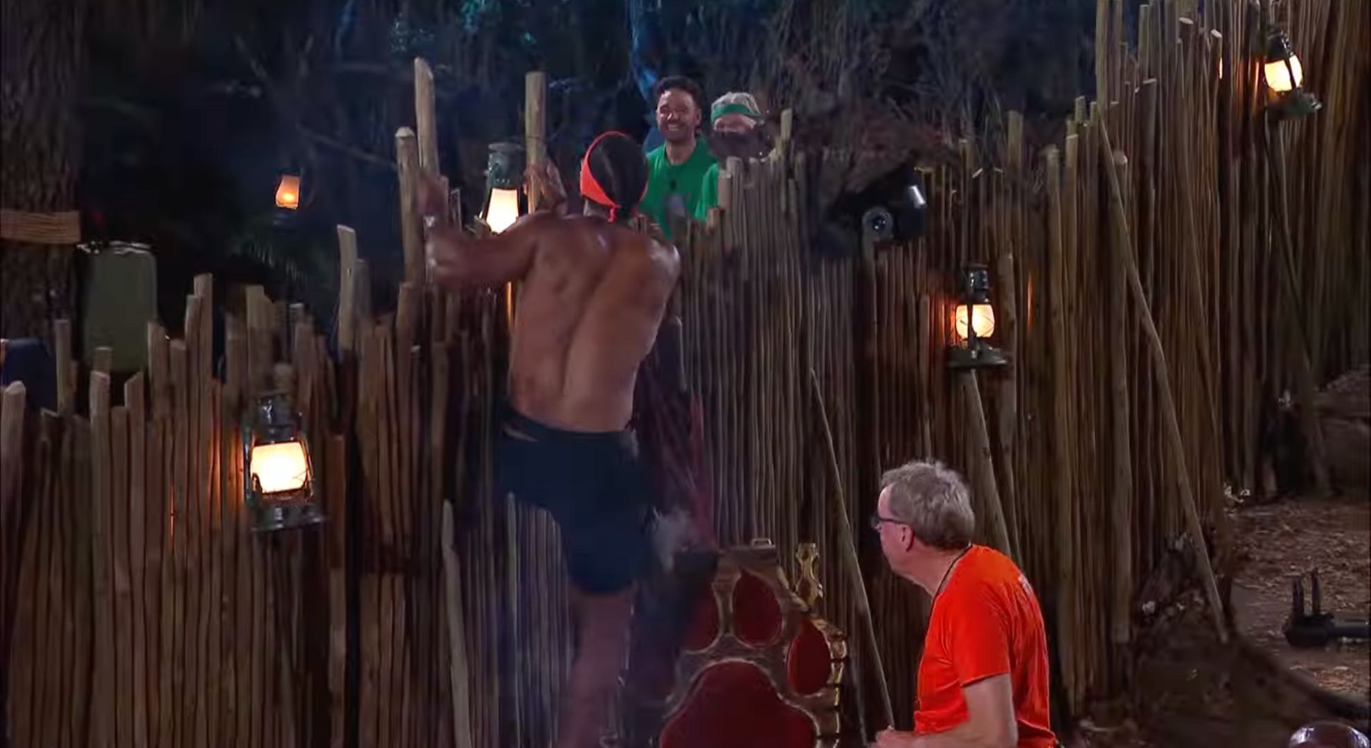 David Haye climbing a fence as Harry Redknapp watches on I'm A Celeb