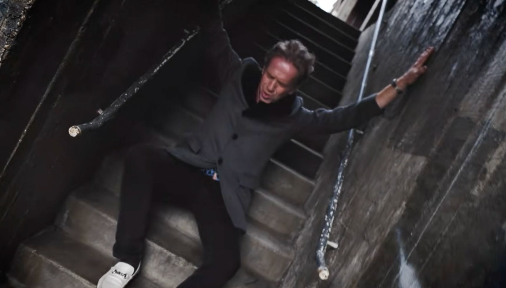 Damian in music video stairwell 