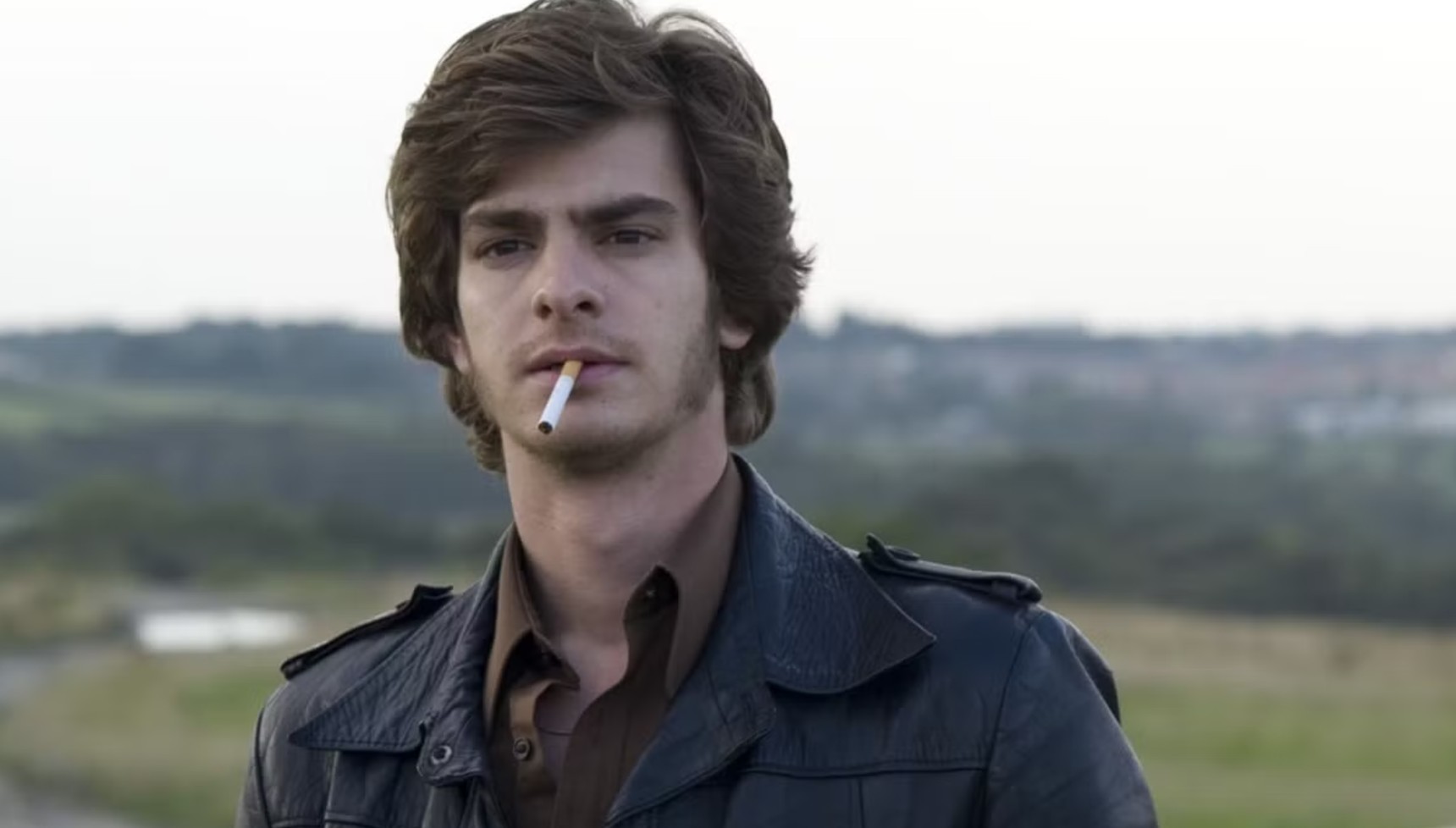 Andrew Garfield smoking a cigarette in Red Riding 1974