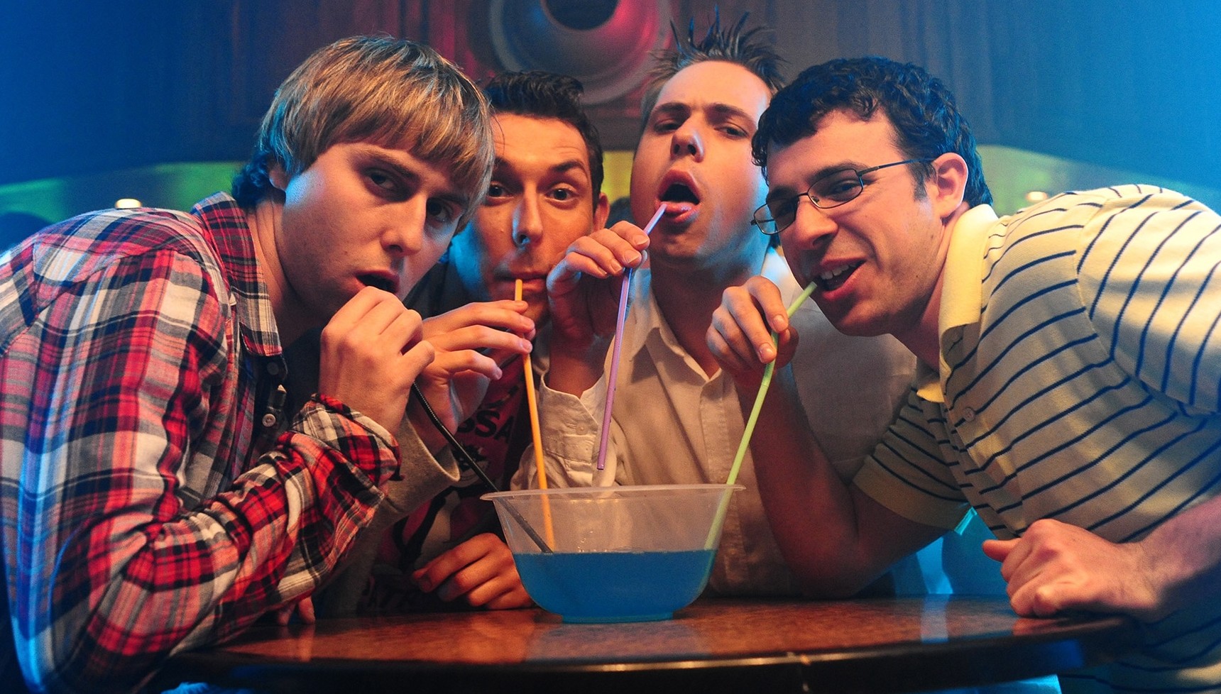 Jay, Neil, Simon, and Will drinking a cocktail
