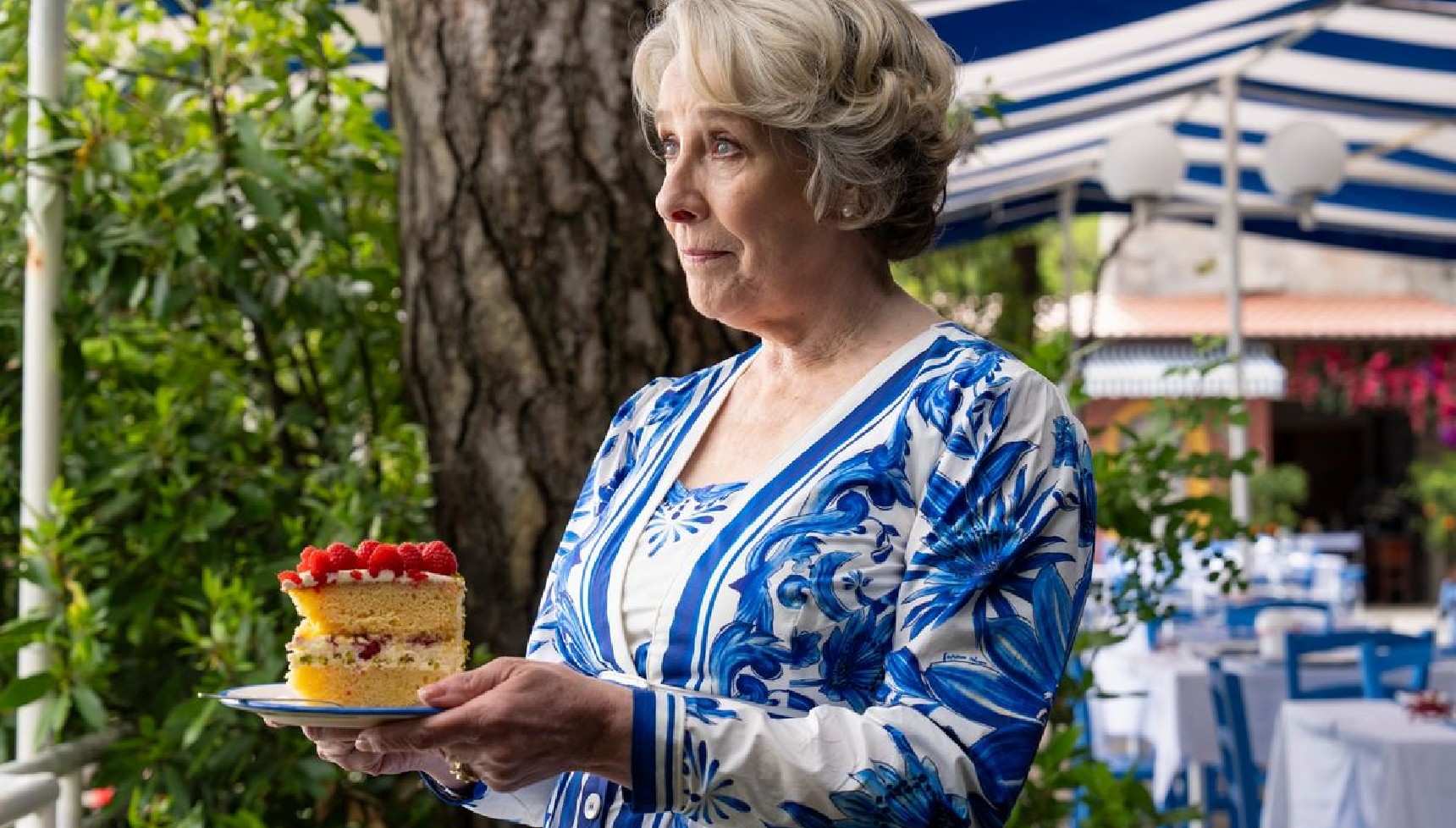 Phyllis Logan as Elena Da Vinale holding Granny's Pistachio Cake in A Taste for Murder