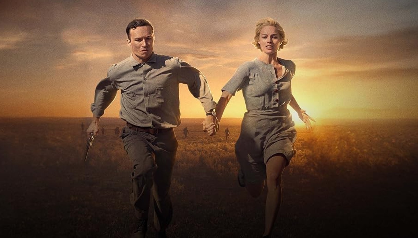 Finn Cole and Margot Robbie running in Dreamland