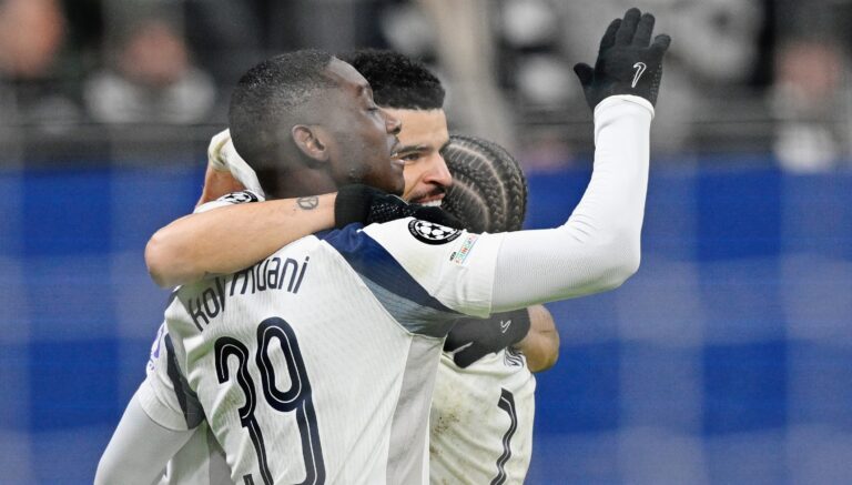 Three Tottenham players hugging