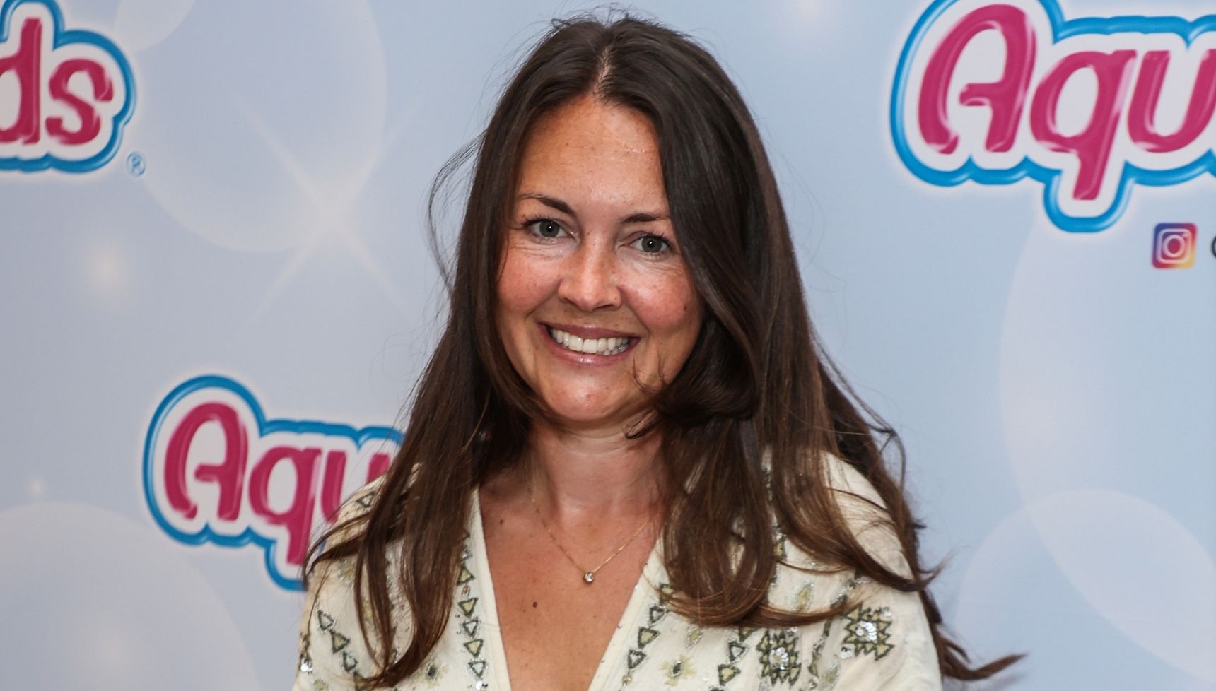 Lacey Turner smiling at event