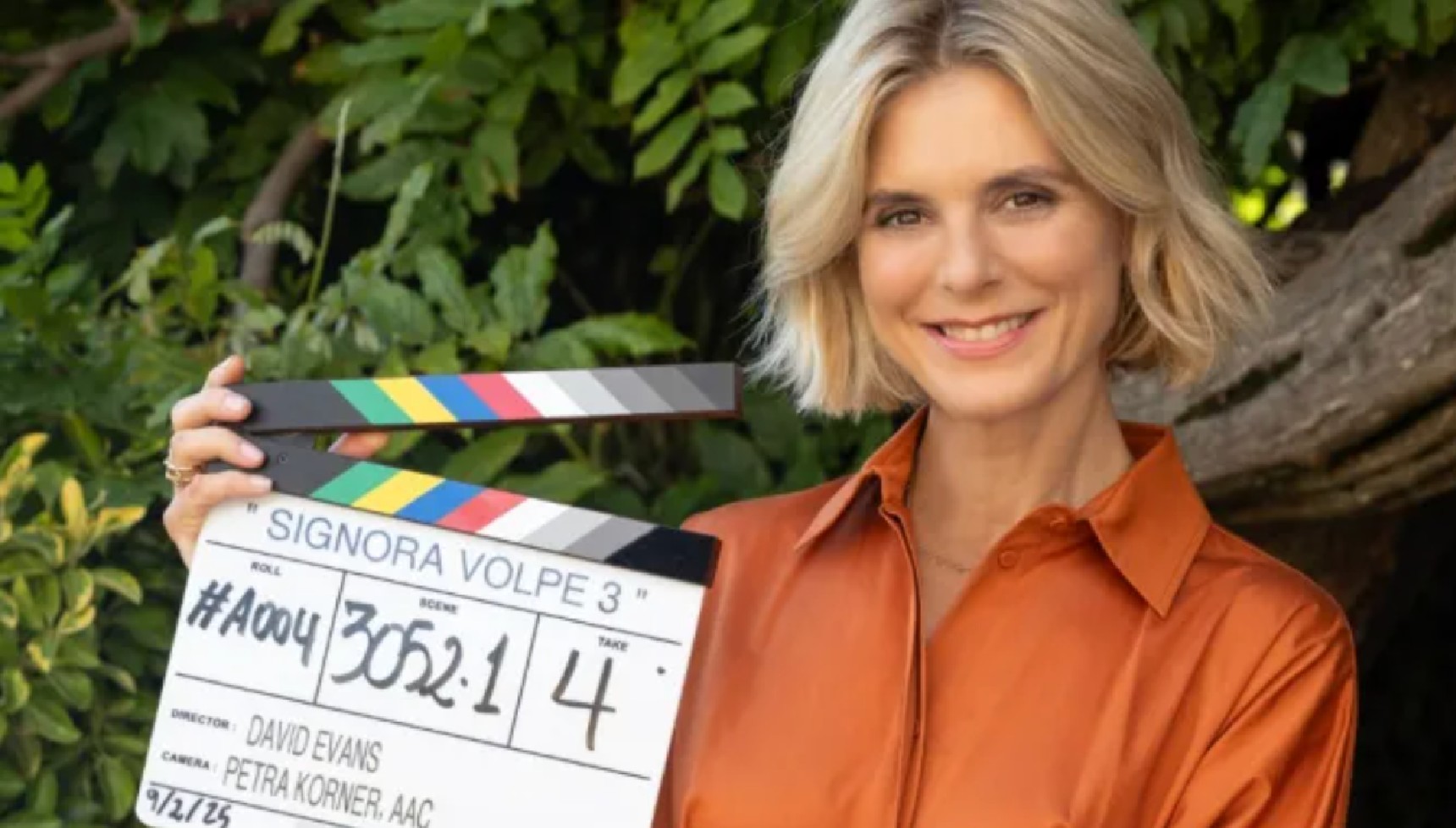 Emilia Fox holding the clapperboard for Signora Volpe series 3