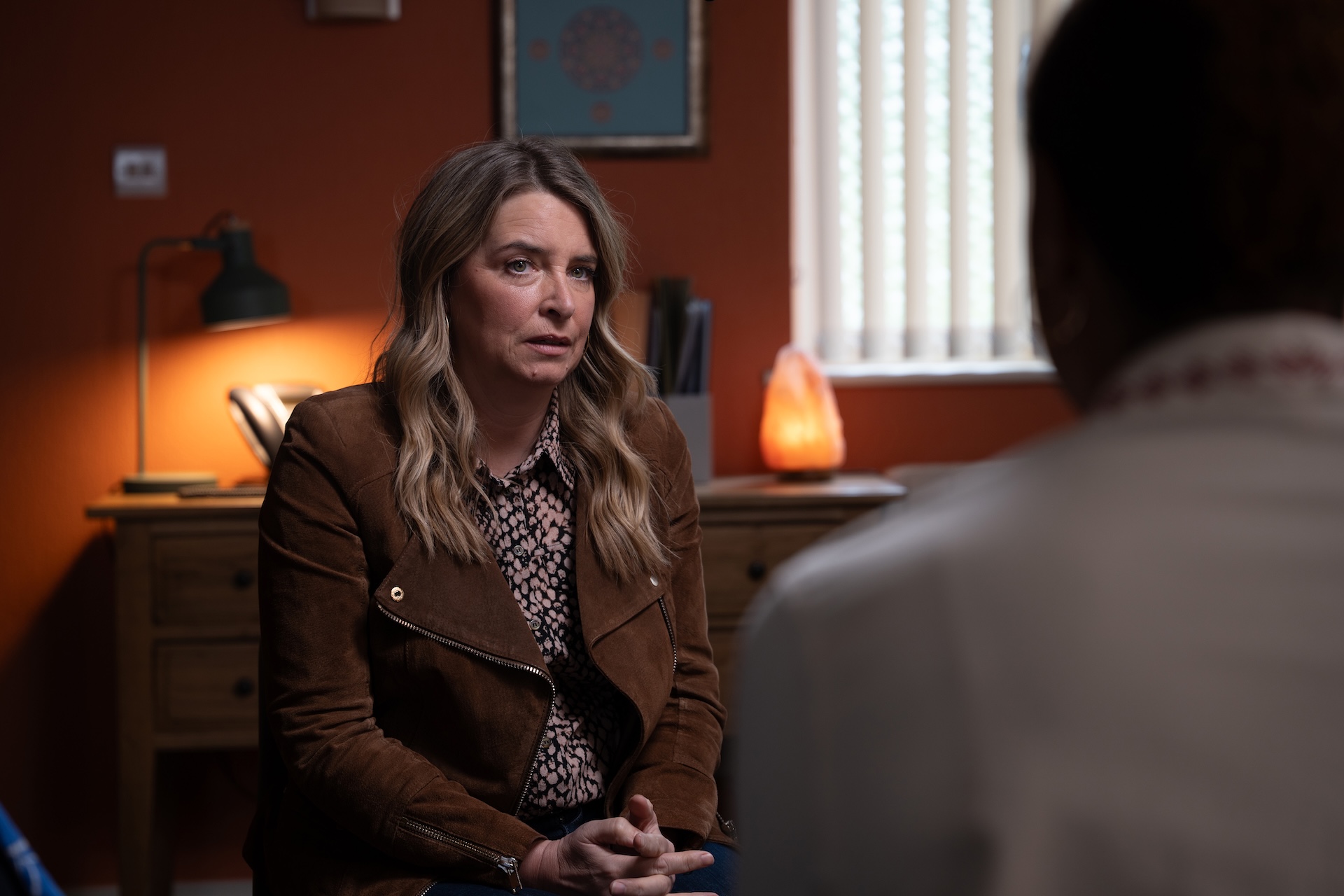 Charity looking nervous as she talks to her support group
