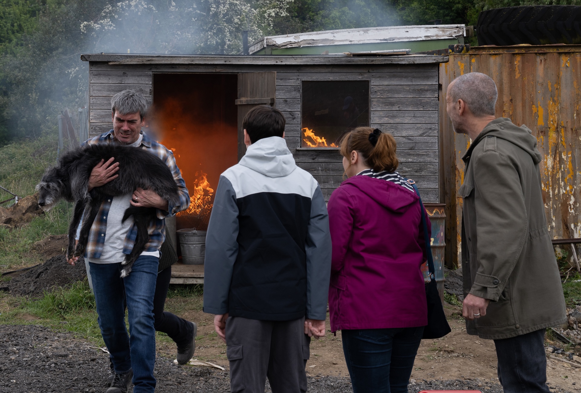 Cain rescuing Monty in fire in Emmerdale