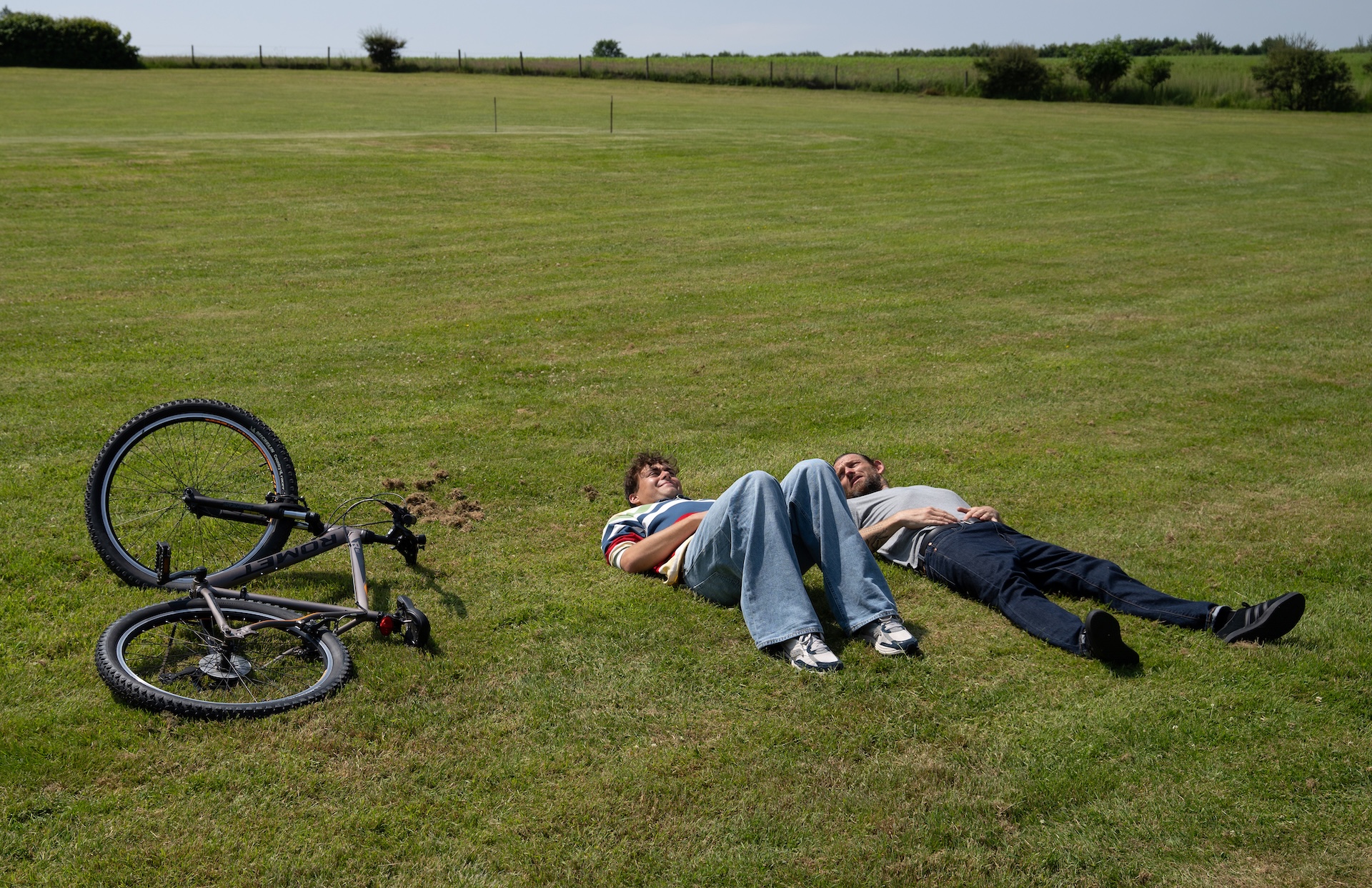 Kev offers to help Lewis ride a bike, but he's hiding something (Credit: ITV)