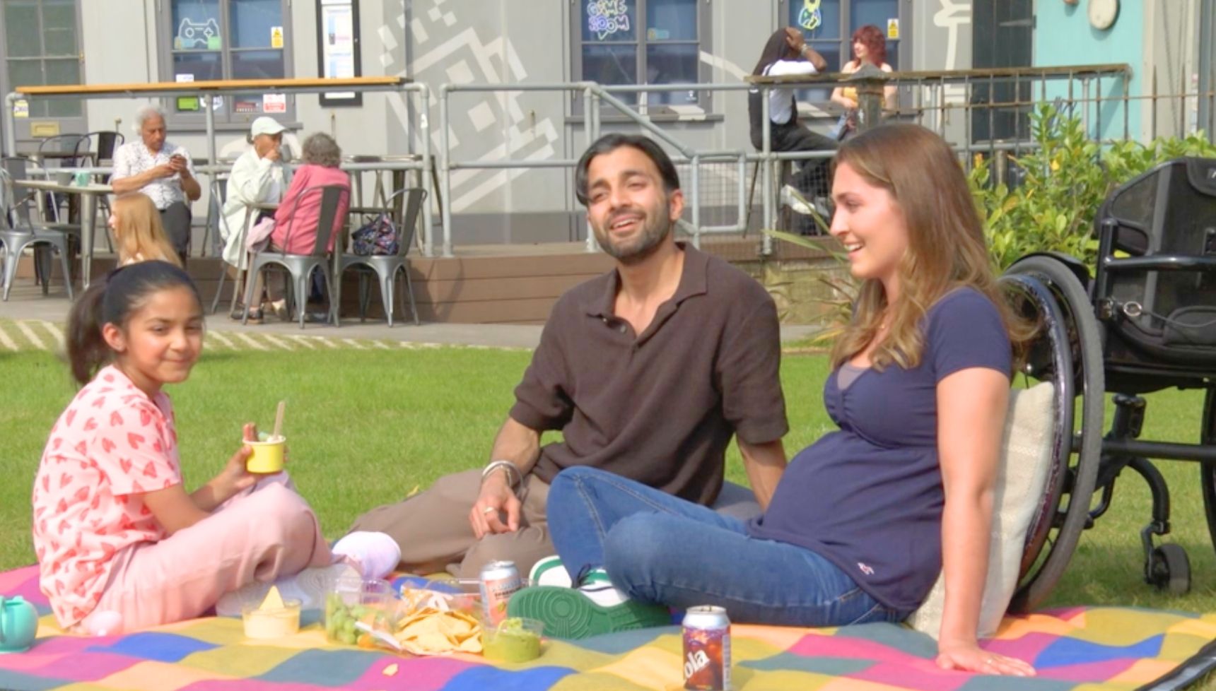 Penny and Vinny having a picnic with Ria in EastEnders