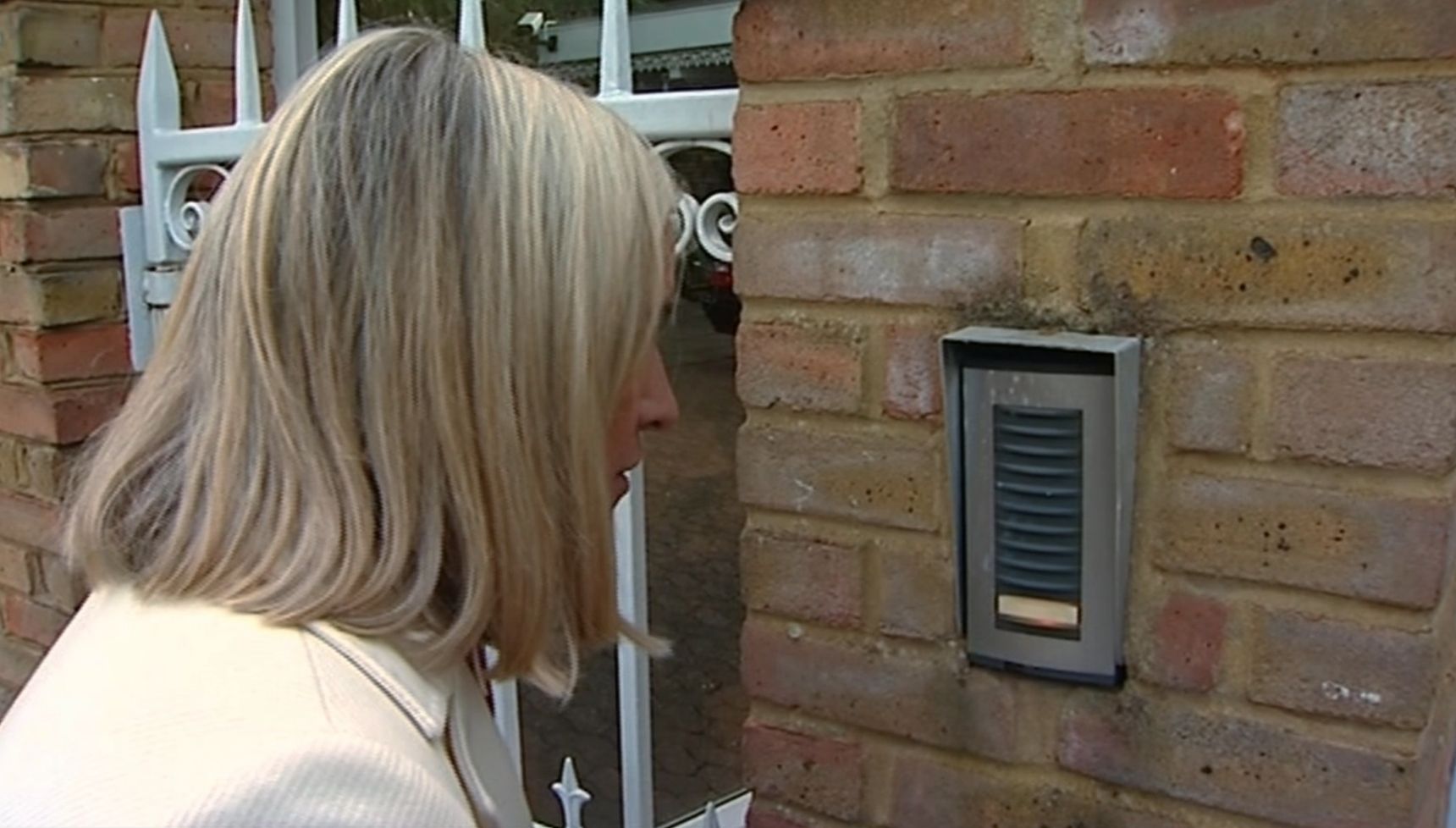 reporter outside Rolf Harris' house