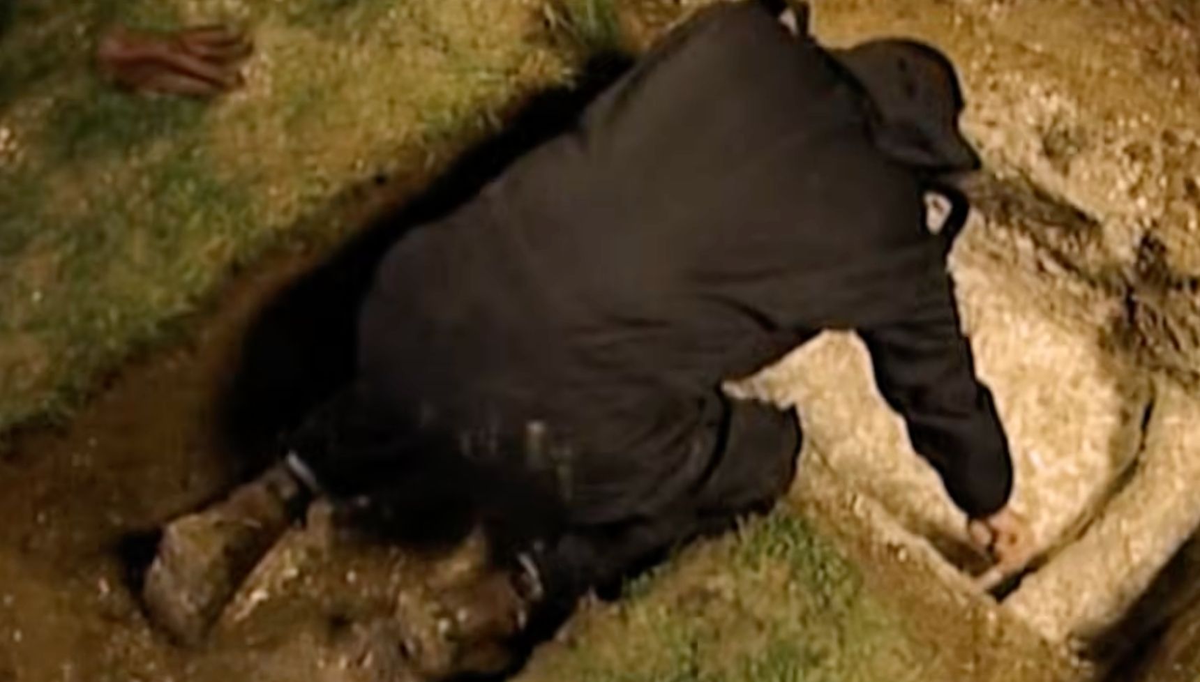 Man digging to find a body