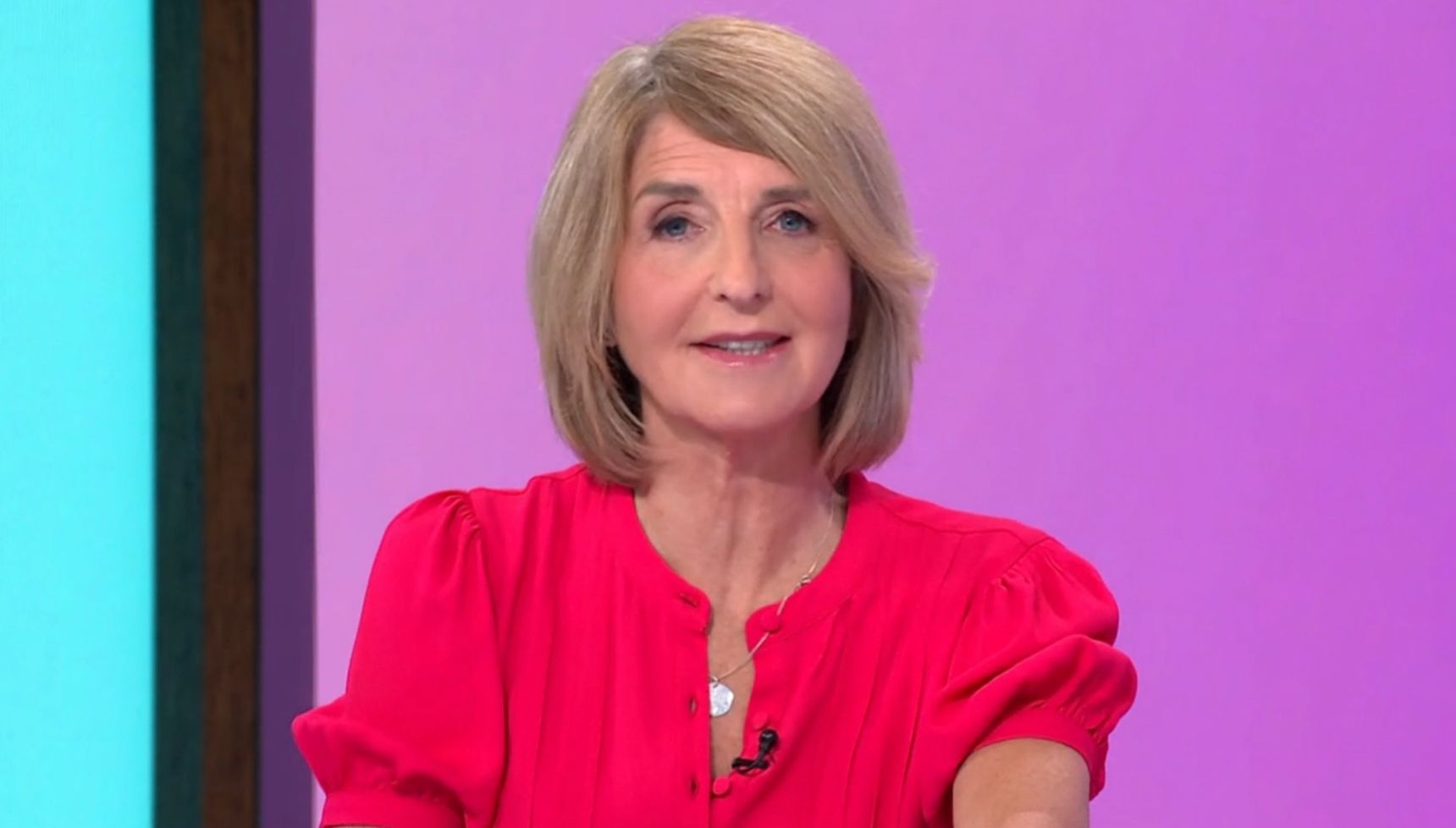 Kaye Adams in bright pink dress