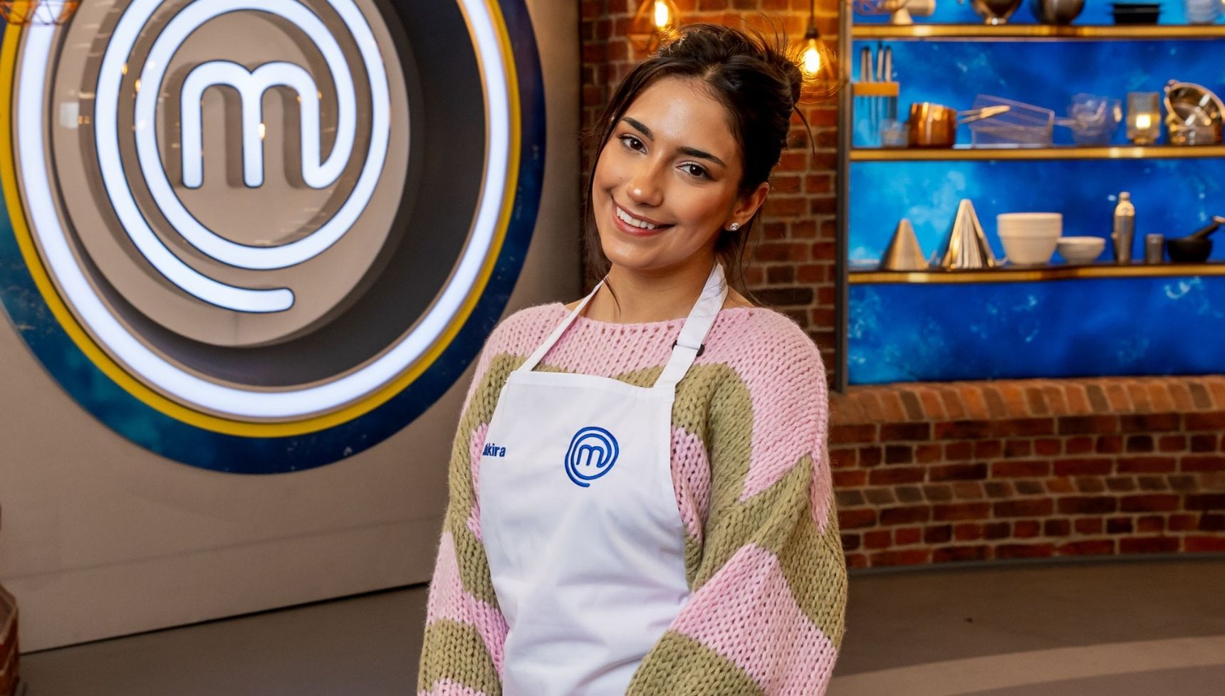 Shakira Khan pink and beige woolly jumper