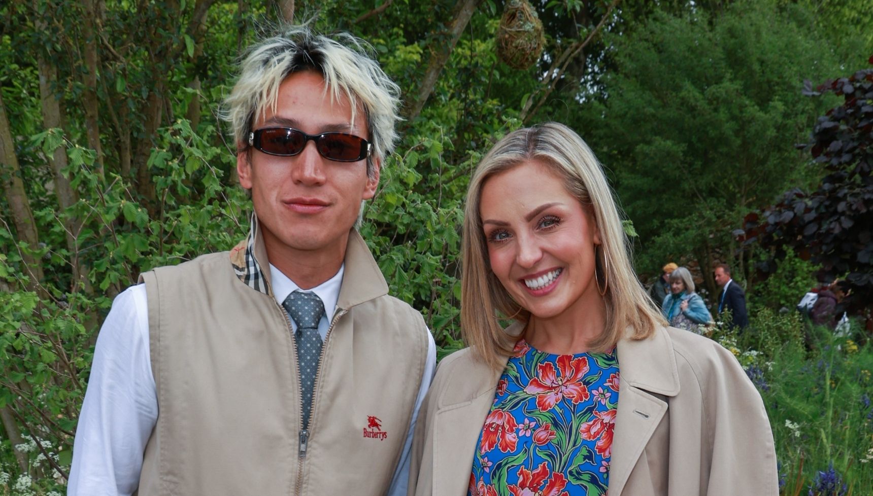 Carlos Gu and Amy Dowden smiling at the Chelsea Flower Show