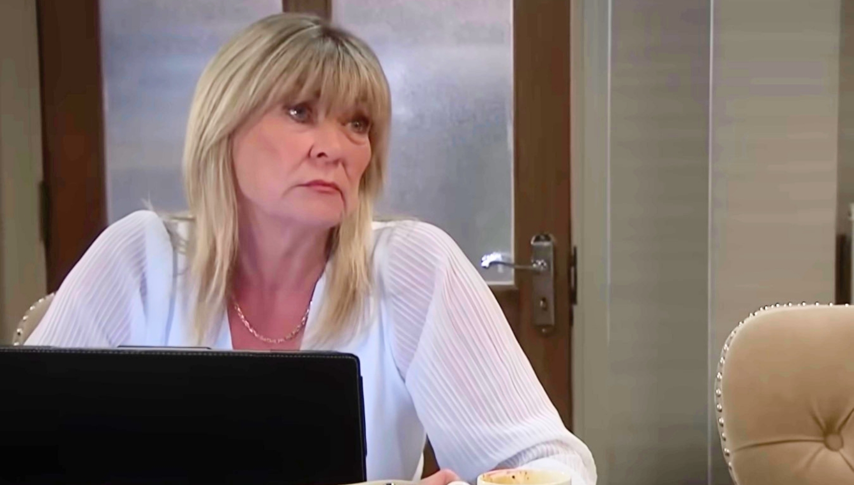 Kim on laptop in Emmerdale