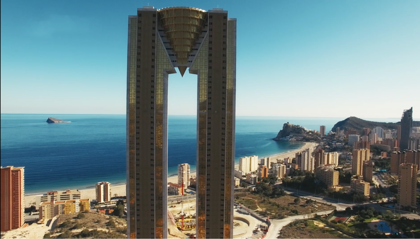 The Intempo skyscraper in Benidorm, Spain, which features a distinctive conical structure connecting its two towers.