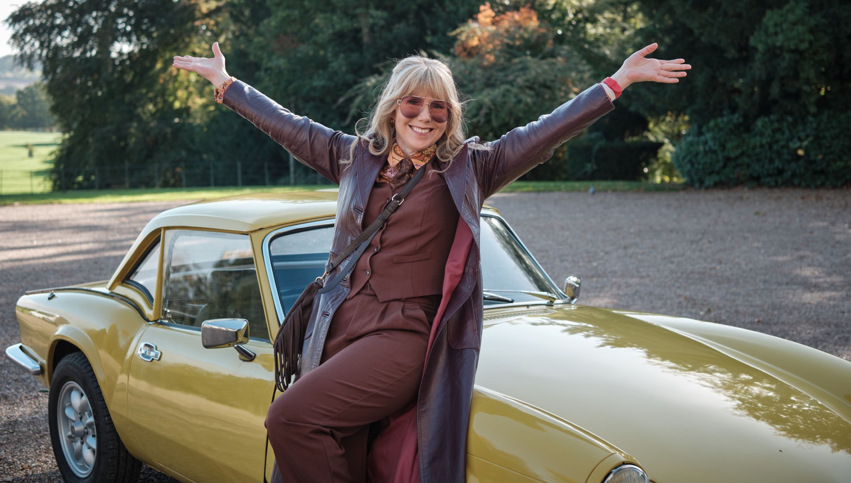 Sally Phillips as Lily Petal on her car in The Hairdresser Mysteries
