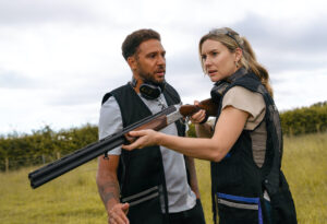 Dawn aims a gun in Joe's direction in Emmerdale