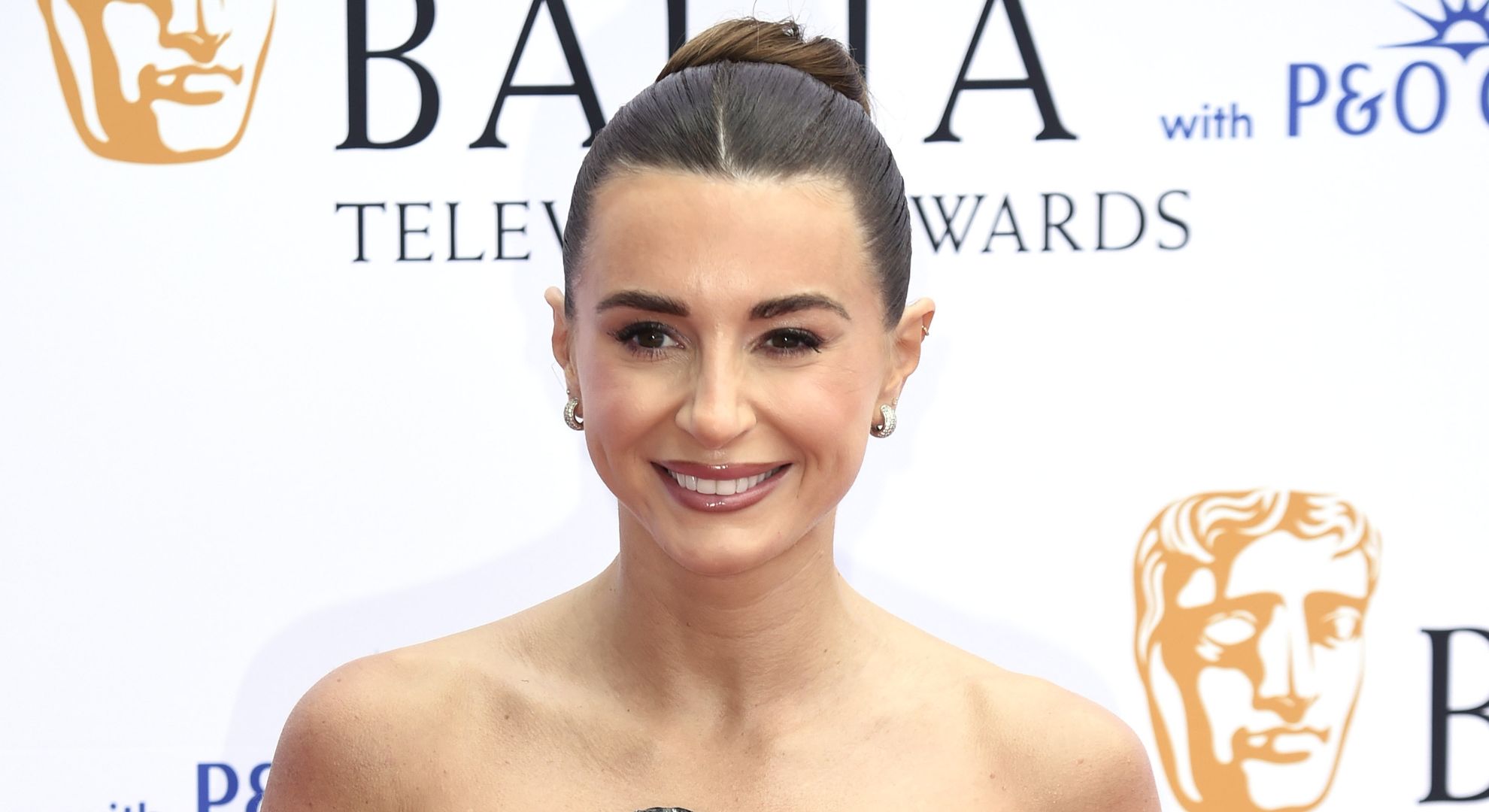 Dani Dyer smiling on the red carpet 
