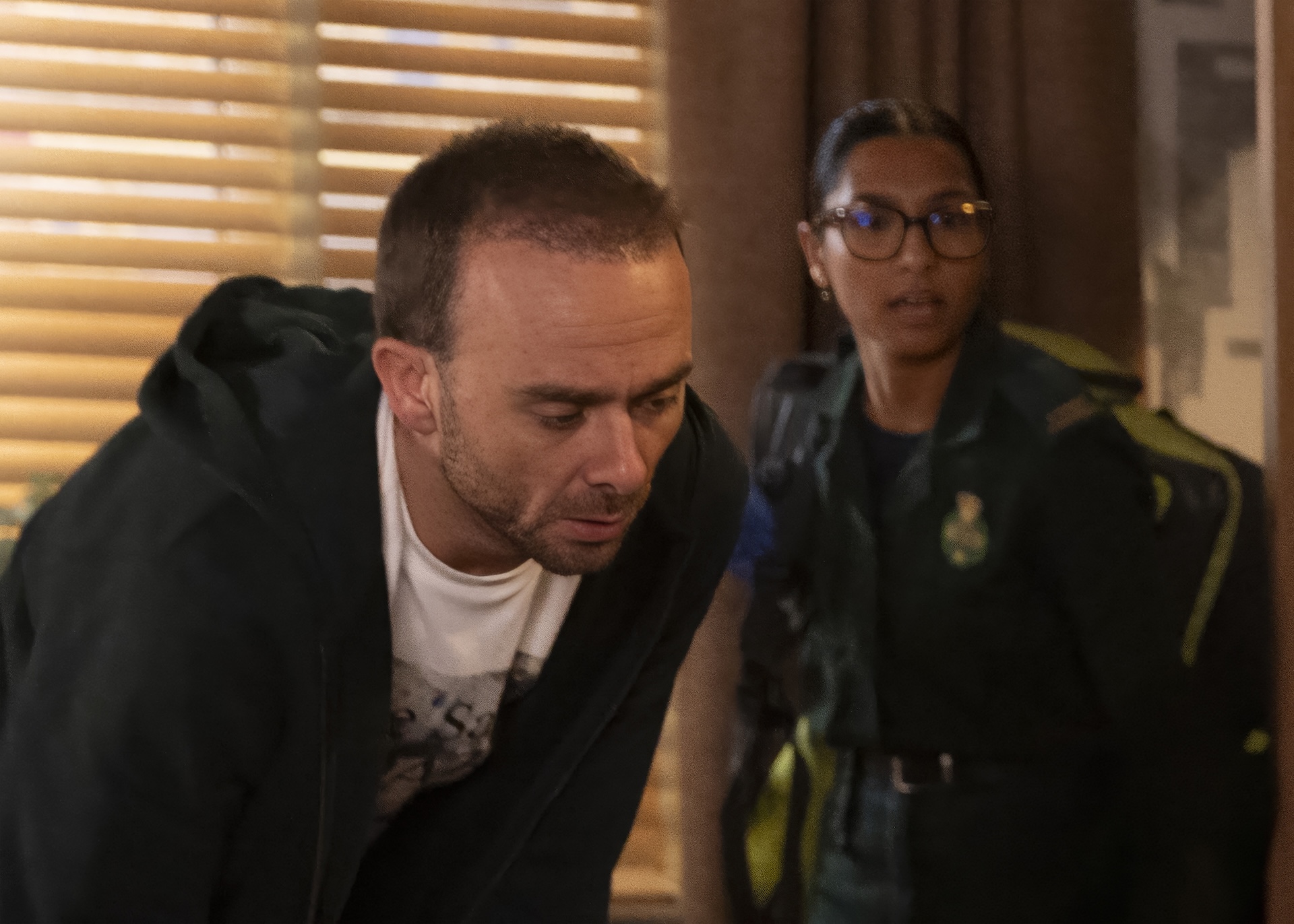 David and the paramedics tend to the injured (Credit: ITV)