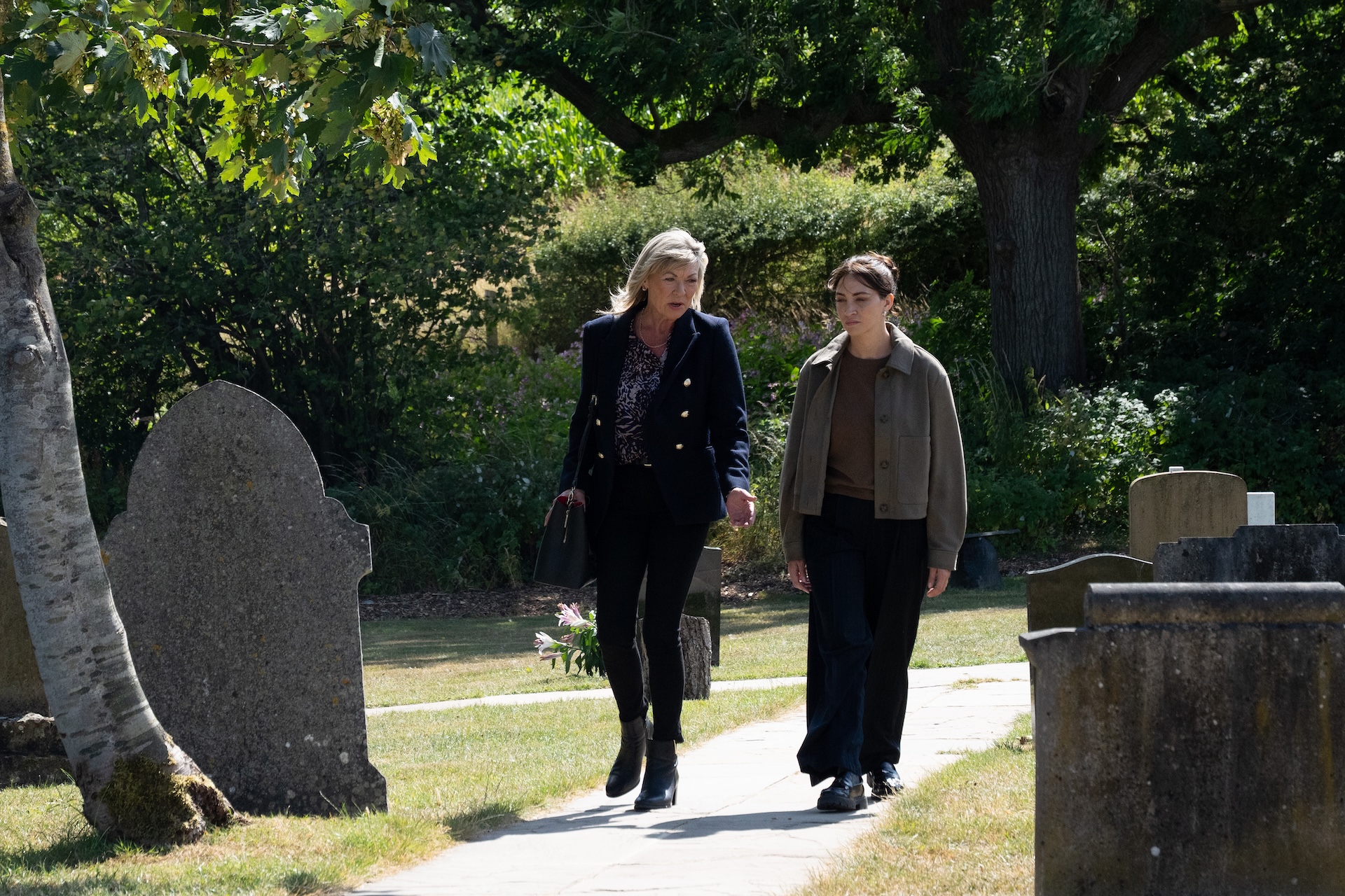 Kim and Thea walk in the graveyard in Emmerdale