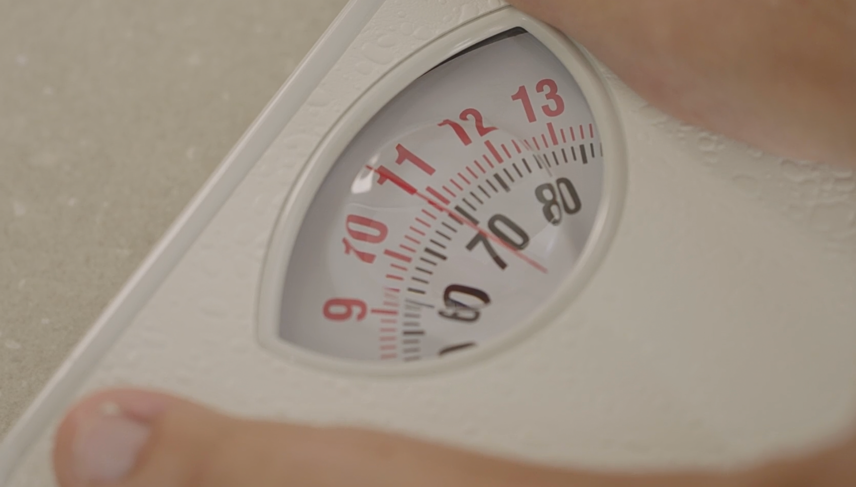 Sue Radford steps on the scales 