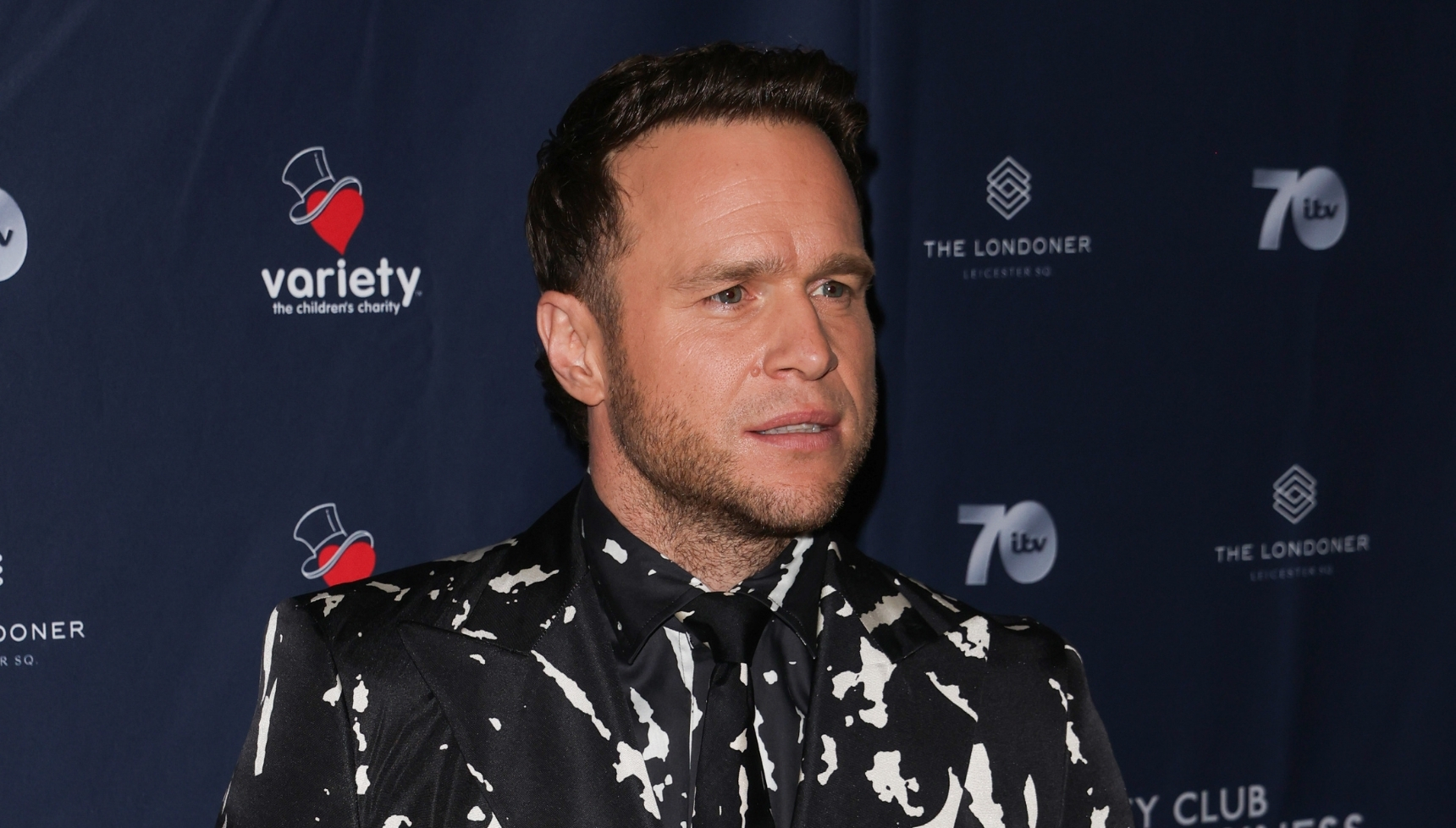 Olly Murs frowning at event