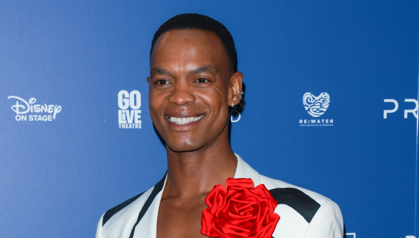 Strictly star Johannes Radebe smiling at event