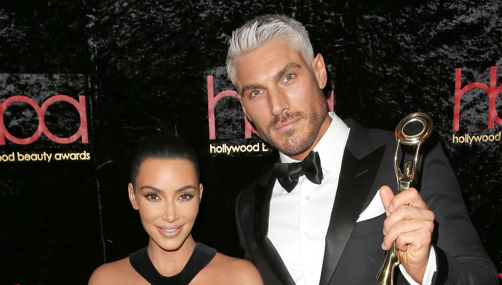 Kim Kardashian and Chris Appleton smiling at event