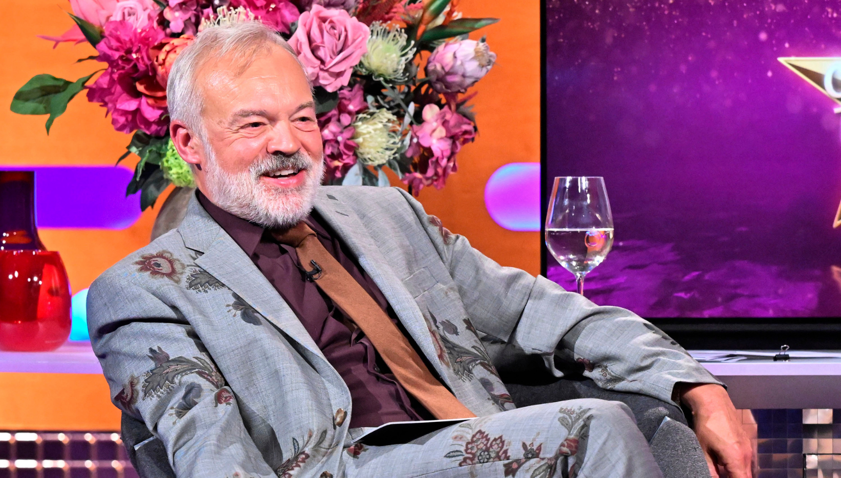 Graham Norton in a silver jacket