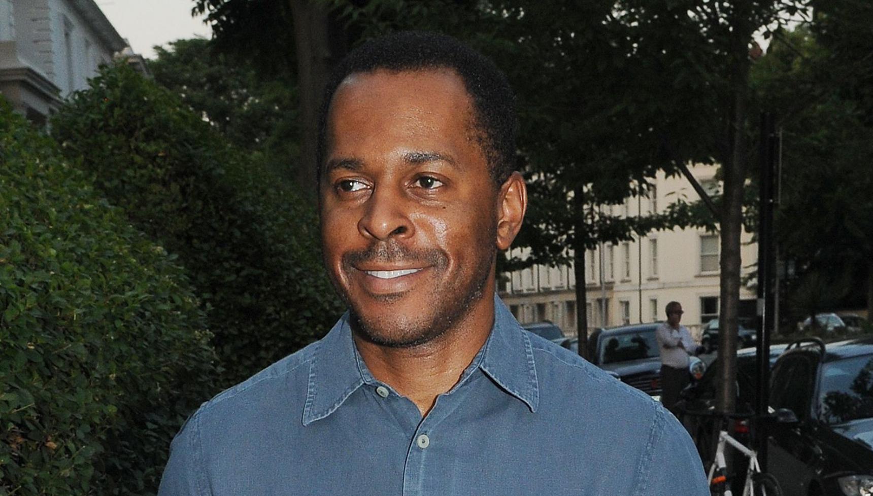 Andi Peters wears denim shirt