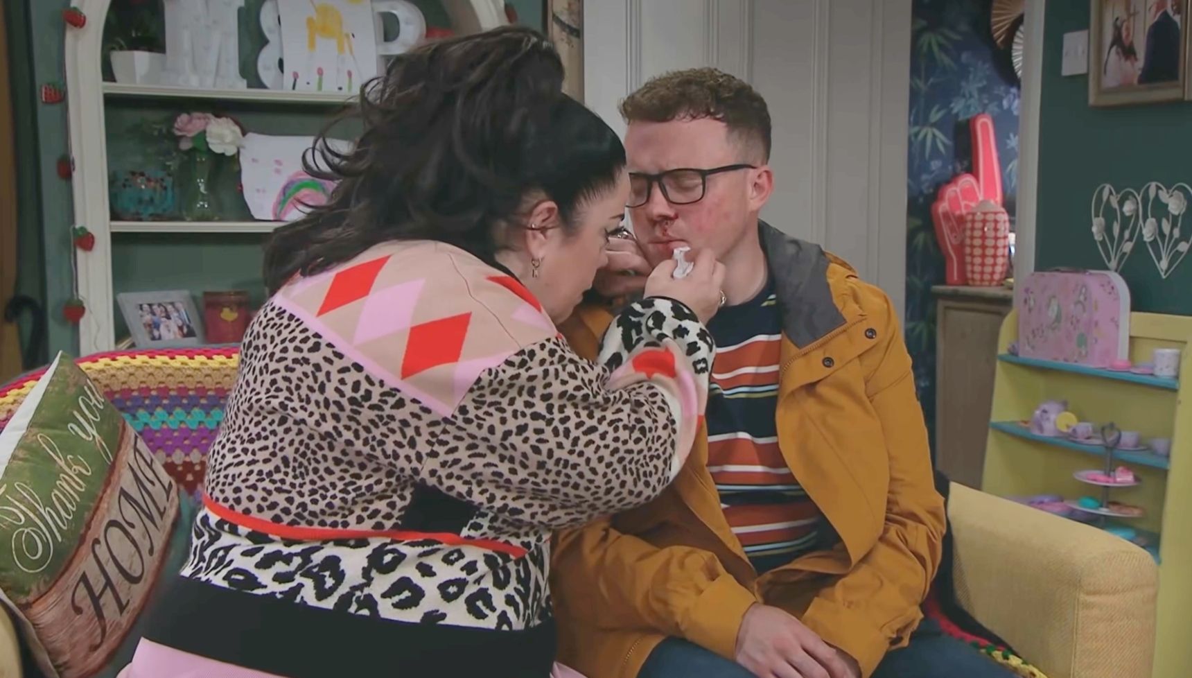Mandy trying to clean Vinny's bloody nose in Emmerdale 
