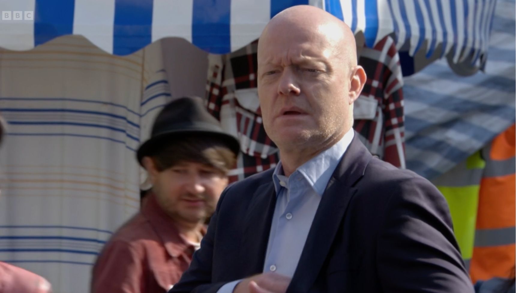 Max looking shocked as he watches Amy in EastEnders (Credit: BBC)