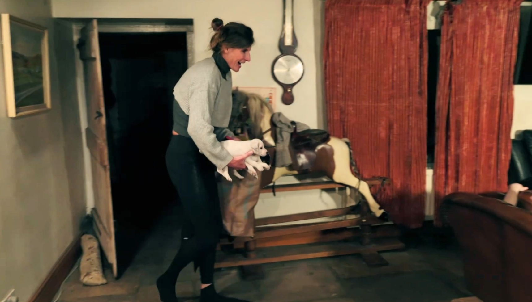 Amanda Owen carrying puppies in Our Farm Next door series 4
