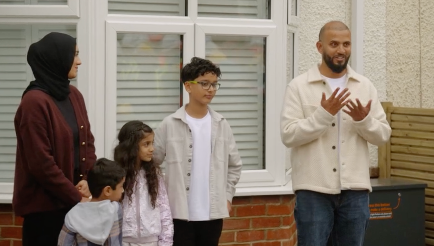 DIY SOS Ahmed and Rifat outside new home