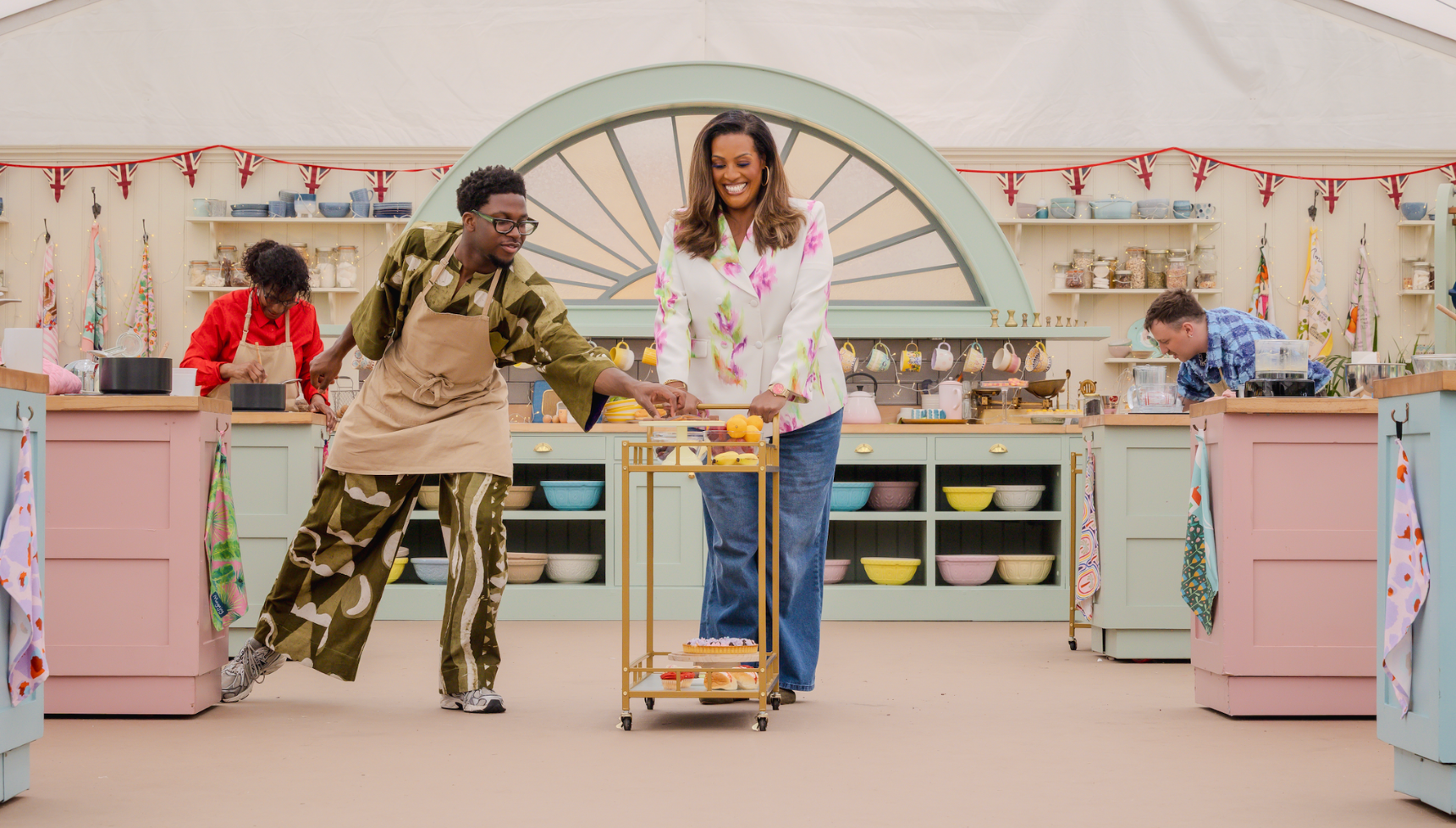Alison Hammond pushing a dessert trolley