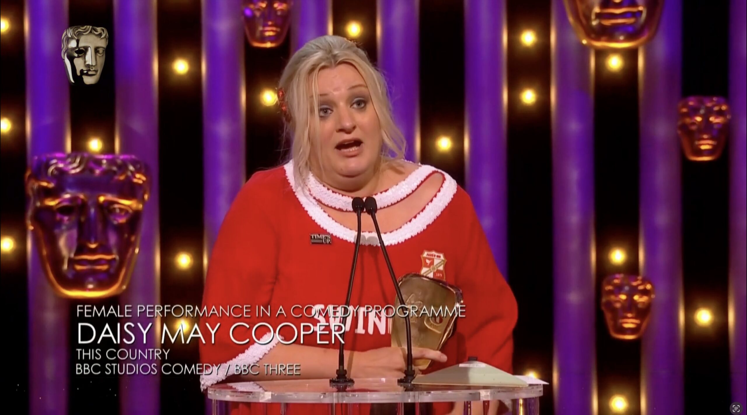 Daisy May Cooper accepting BAFTA